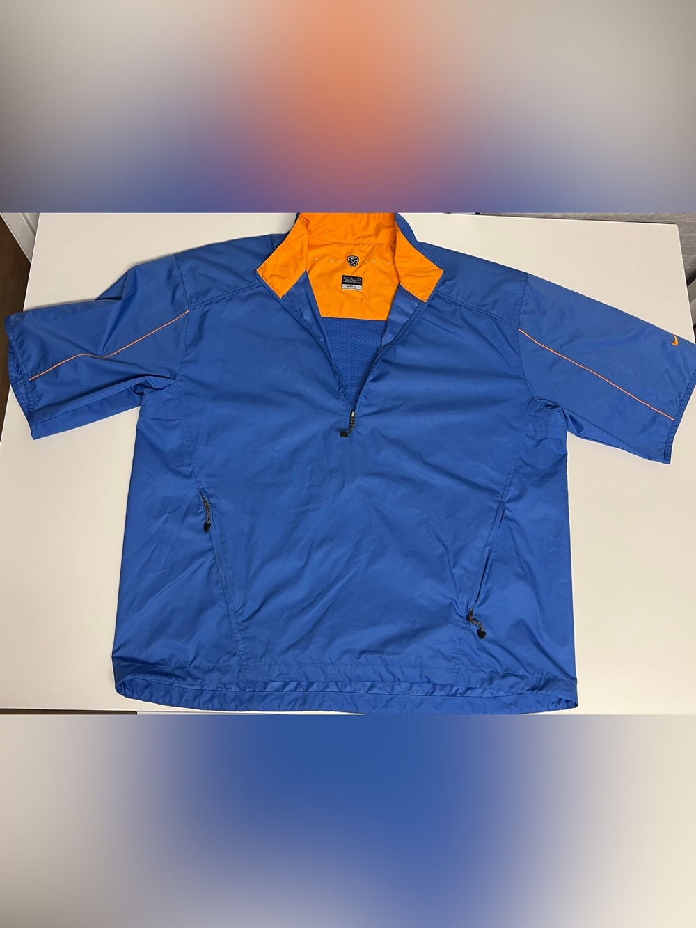 Nike Men’s Blue Short-Sleeve Wind Breaker Golf Shirt with Orange Collar